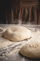 Closeup of women hands kneading dough