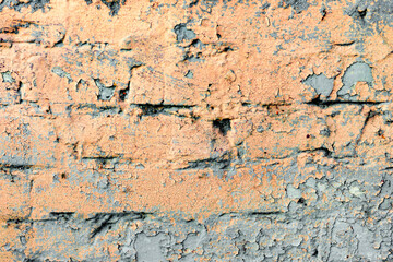 Texture of a brick wall with cracks and scratches which can be used as a background