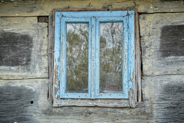 Very old wooden window in the wall