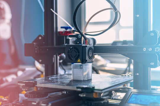 The 3D printer prints white transparent plastic model