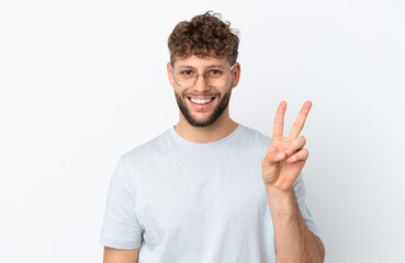 Young handsome caucasian man isolated on white background With glasses and doing OK sign