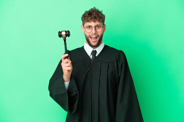Judge over isolated green background with surprise facial expression