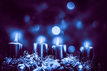 four silver burning candles on advent wreath, dramatic and contract, christmas concept