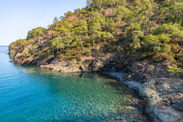 Naklejka na ściany i meble Beautiful nature landscape in Turkey coastline. View from Lycian way to small bay. This is ancient trekking path famous among hikers. Turkey, Ulupinar.