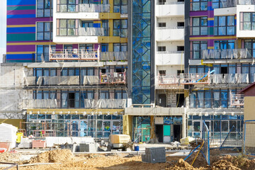 Photo of the construction of a multi-storey buildings and houses