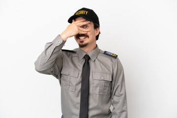Young caucasian security man isolated on white background covering eyes by hands and smiling