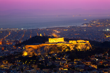 Athens postcard. Sunset view of Parthenon Temple at the Acropolis Hill, Athens and harbour. View...