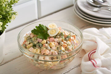traditional russian salad (olivier) white background