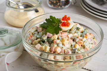 traditional russian salad (olivier) white background