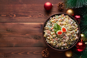 traditional russian salad (olivier) dark brown background new years tree new year tree decorations