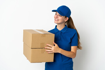 Young delivery woman isolated on white background looking to the side and smiling