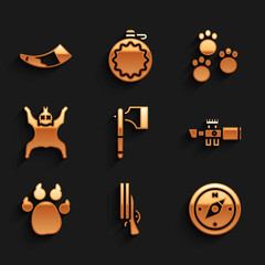 Set Wooden axe, Shotgun, Compass, Sniper optical sight, Paw print, Bear skin, and Hunting horn icon. Vector