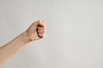 Hand gestures. Hand gestures. woman's fist stretches up, a symbol of the struggle for rights and...