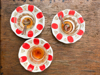 empty dirty Turkish tea glasses on the wooden table with copy space