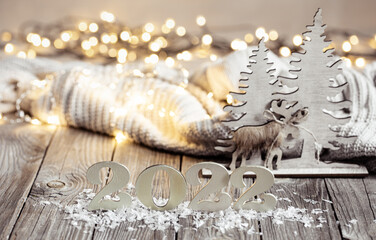 Cozy Christmas composition with number 2022 and decor details.