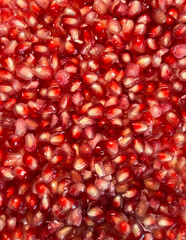 Red Pomegranate seeds closeup background