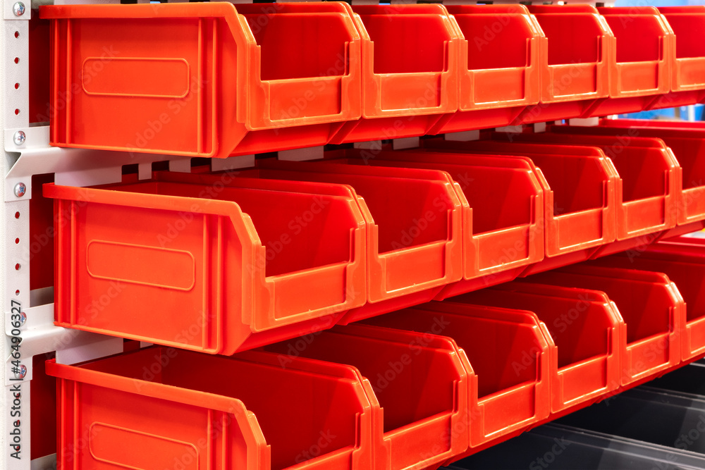 Poster rows of multicolored plastic boxes for components