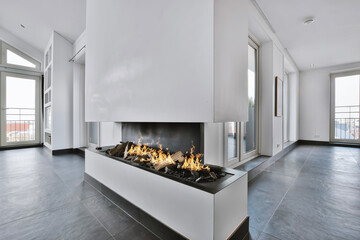 Interior of a stylish room with a fireplace - obrazy, fototapety, plakaty