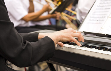Pianist playing piano.The man plays the piano © O.PASH