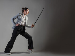 A businesswoman in a business casual suit attacks competitors,