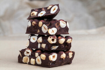 milk chocolate with whole and chunks of hazelnuts