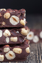 milk chocolate with whole and chunks of hazelnuts