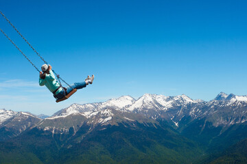 Swing over the abyss, light extreme, entertainment. The feeling of freedom and flight in the...