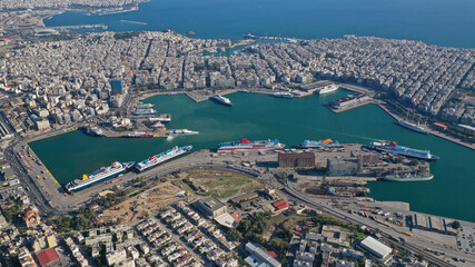 Aerial drone photo of famous and busy port of Piraeus where passenger ferries travel to Aegean destination islands as seen from high altitude , Attica, Greece