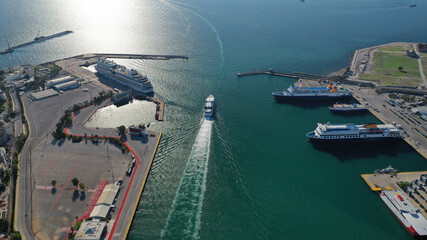 Aerial drone photo of famous and busy port of Piraeus where passenger ferries travel to Aegean...
