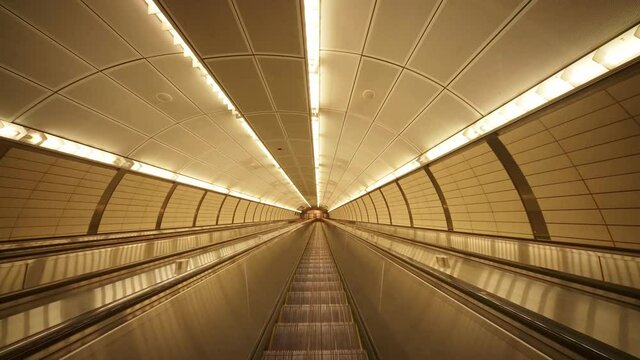 Empty New York subway escalator. Manhattan, New York City metro. Concept of NYC as urban lifestyle, tourism destination in America, modern city USA.