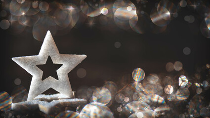 White Star with glitter, lights and Bokeh Background at Christmas time