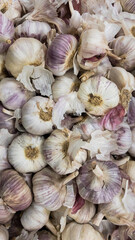 Fruits and vegetables background.  Healthy Living: Elevate Your Well-being with Nutritious Habits! Close-up of garlics in a supermarket.