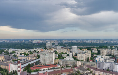 Beautiful panorama of the city center of Kiev and the Pechersk district from a height. View of the left bank and overhanging rain clouds
