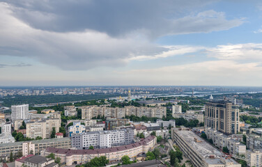 Beautiful panorama of the city center of Kiev and the Pechersk district from a height. View of the left bank and overhanging rain clouds