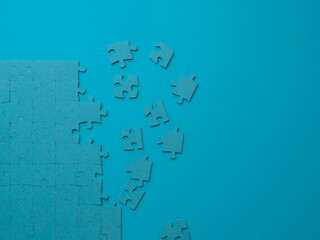 A set of puzzles, the process of collecting in a large pattern. Teamwork and problem solving, concept.