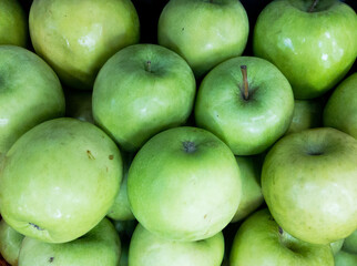 Fruits and vegetables background.  Healthy Living: Elevate Your Well-being with Nutritious Habits!  Close-up of apples in a supermarket.