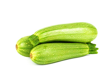 Three zucchinis isolated on white background