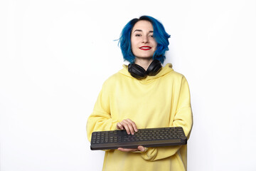 A female in casual style holding keyboard