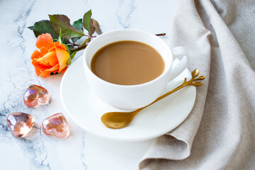 americano in a white cup and decorative hearts