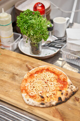 Neapolitan Iberian ham artisan pizza. pizza with bacon ham and sausage on wooden table. kitchen