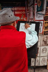 cartoonist painting a person on the street