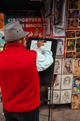 cartoonist painting a person on the street