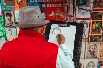 cartoonist painting a person on the street