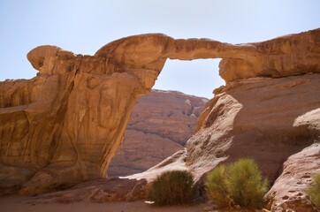 Magnificient rock arch in Wadi Rum desert, Jordan