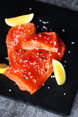 Fresh red fish. Salmon with spices. Fish for sushi.