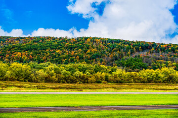 Autumn Landscape with mountain, forest and Airport Runway and Taxiway