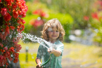 Naklejka premium Adorable little boy is watering the plant outside the house, concept of plant growing learning activity for kid and child education for the tree in nature.