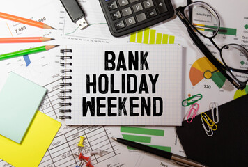Closeup on businessman holding a card with BANK HOLIDAY WEEKEND message, business concept image.