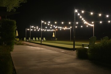 Bocce ball court lit up at night