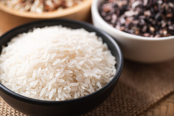 Close up of Organic Thai Jasmine rice grain in a black bowl